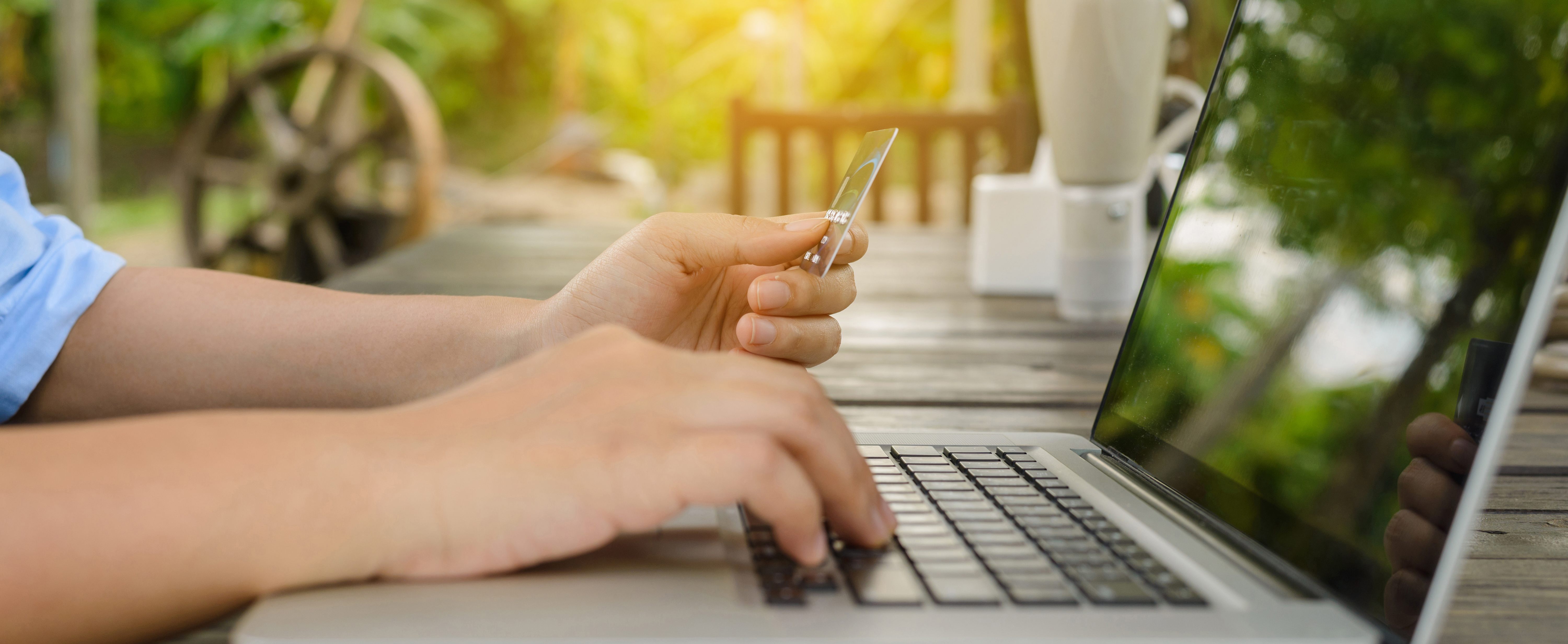 woman-holding-credit-card-hand-entering-